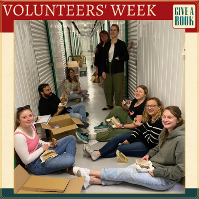 A group of smiling volunteers at our Store Day, having a well deserved rest after packing up thousands of books!